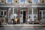 Pubs reopen as lockdown eases and begin serving customers outside.