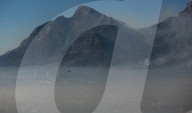 Smoke Haze over Cape Town as fire fighters and helicopters battle with flare ups on day 3 of the Table Mountain Fire.