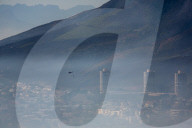 Smoke Haze over Cape Town as fire fighters and helicopters battle with flare ups on day 3 of the Table Mountain Fire.