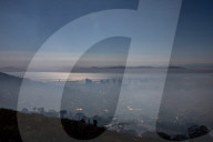 Smoke Haze over Cape Town as fire fighters and helicopters battle with flare ups on day 3 of the Table Mountain Fire.