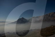 Smoke Haze over Cape Town as fire fighters and helicopters battle with flare ups on day 3 of the Table Mountain Fire.