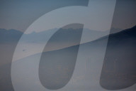 Smoke Haze over Cape Town as fire fighters and helicopters battle with flare ups on day 3 of the Table Mountain Fire.