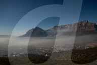 Smoke Haze over Cape Town as fire fighters and helicopters battle with flare ups on day 3 of the Table Mountain Fire.
