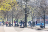 Members of the public enjoy the sunshine in Hyde Park.
