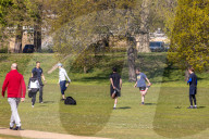 Members of the public enjoy the sunshine in Hyde Park.
