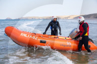 ‘Respect the water’: RNLI lifeguard training in Cornwall. Ahead of a busy summer of domestic tourism in the UK, qualified lifeguards and trainees rehearse life-saving procedures