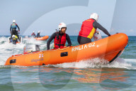 ‘Respect the water’: RNLI lifeguard training in Cornwall. Ahead of a busy summer of domestic tourism in the UK, qualified lifeguards and trainees rehearse life-saving procedures