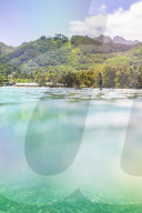 Paddleboarding in Muri Lagoon with Rarotonga in the background, Cook Islands