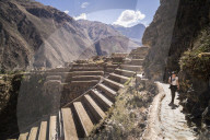 Woman exploring Inca Ruins of Ollantaytambo, Sacred Valley of the Incas (Urubamba Valley), near Cusco, Peru