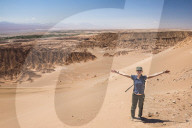 Tourists in sand dunes at Death Valley (Valle de la Muerte), San Pedro de Atacama, Atacama Desert, North Chile