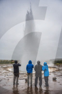 Tourists watching Strokkur Geyser erupt, Geysir, The Golden Circle, Iceland