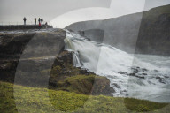 Tourists at Gullfoss Waterfall in the canyon of the Hvita River, The Golden Circle, Iceland