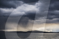 Dramatic storm clouds over Lake Titicaca, Peru