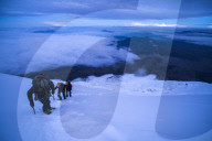 Climbers near the summit of Cotopaxi Volcano 5,897m glacier covered summit, Cotopaxi National Park, Cotopaxi Province, Ecuador