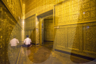 Man praying at Botataung Pagoda, Yangon (Rangoon), Myanmar (Burma)