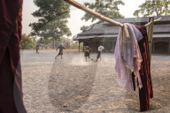 Novice monks playing football at a Buddhist Monastery between Inle Lake and Kalaw, Shan State, Myanmar (Burma)