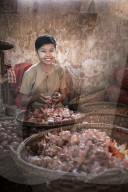 Hsipaw market, portrait of a woman peeling onions, Shan State, Myanmar (Burma)