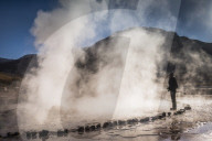 Tourist at El Tatio Geysers (Geysers del Tatio), the largest geyser field in the Southern Hemisphere, Atacama Desert, Chile