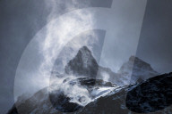 Wind sweeping snow off mountains, Torres del Paine National Park, Patagonia, Chile