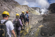 Tourists exploring White Island Volcano, an active volcano in the Bay of Plenty, North Island, New Zealand
