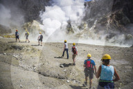 Tourists exploring White Island Volcano, an active volcano in the Bay of Plenty, North Island, New Zealand