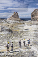 Tourists exploring White Island Volcano, an active volcano in the Bay of Plenty, North Island, New Zealand