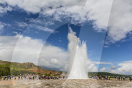 Tourists gather to watch Strokker geyser (geysir), an erupting spring at Haukadalur, Iceland, Polar Regions