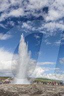 Tourists gather to watch Strokker geyser (geysir), an erupting spring at Haukadalur, Iceland, Polar Regions