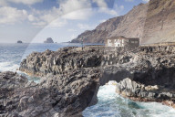 Rock arch and Hotel Punta Grande, Las Puntas, El Golfo, lava coast, UNESCO biosphere reserve, El Hierro, Canary Islands, Spain