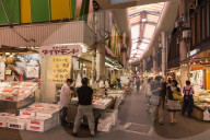 Shoppers at Omicho fresh food market, busy and colourful network of covered streets lined by stalls, Kanazawa, Japan
