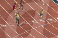 Usain Bolt crosses line with finger to lips, looks at Yohan Blake, Men's 200m final, London 2012, Olympic Games, London, England, United Kingdom, Europe
