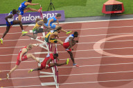 Competitors in Men's 110m hurdles semi-final clear hurdles, London 2012 Stadium, Summer Olympic Games, London, England, United Kingdom, Europe