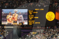 Medal ceremony Men's 100m on big screen, Olympic flame, crowds, Olympic Stadium, London 2012, Olympic Games, London, England, United Kingdom, Europe