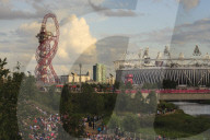 Crowds in the Olympic Park in early evening, with Orbit and Olympic Stadium, London 2012, Summer Olympic Games, London, England, United Kingdom, Europe