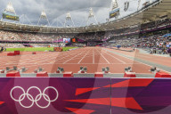 Olympic rings and starting blocks, track side, busy Olympic Stadium pre-session, London 2012, Olympic Games, London, England, United Kingdom, Europe