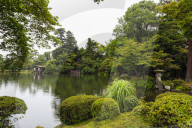 Rain drops fall on Kasumigaike Pond in summer, Kenrokuen, one of Japan's three most beautiful landscape gardens, Kanazawa, Japan, Asia