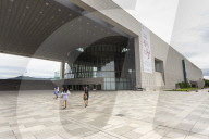 Visitors approach the Great Hall, National Museum of Korea, with distant N Seoul Tower, Yongsan-Gu, Seoul, South Korea, Asia