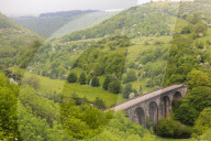 Monsal Trail viaduct, Monsal Head, Monsal Dale, former rail line, trees in full leaf in summer, Peak District, Derbyshire, England, United Kingdom, Europe