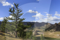 Elevated view towards Turtle Rock and distant mountains, busy with visitors, Summer, Terelj National Park, Central Mongolia