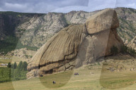 Turtle Rock, rock formation, with many visitors and distant tourist ger camps, Summer, Terelj National Park, Central Mongolia