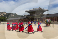 Marching band in bright traditional dress, colourful Changing of the Guard Ceremony, Gyeongbokgung Palace, Seoul, South Korea