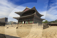 Imperial Throne Hall (Geunjeongjeon) with modern city skyline, Gyeongbokgung Palace, Summer, Seoul, South Korea