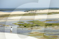 A man looking out from the Funil dune
