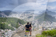 Hikers looking out over Rio de Janeiro from the Morro dos Cabritos hill