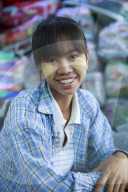 Monywa girl with traditional burmese thanaka face paint