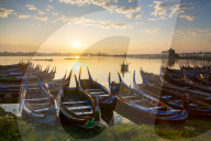 Boats on the Taungthaman Lake near Amarapura with the U Bein teak bridge behind