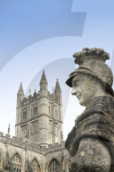 Bath Abbey and a Roman statue in the Roman Baths