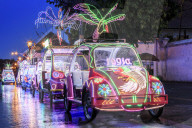 Brightly coloured illuminated pedal cars in Yogyakarta city, Java, Indonesia, Southeast Asia, Asia