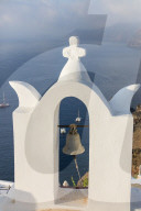 The white steeple of the church and the blue Aegean Sea as symbols of Greece Oia Santorini Cyclades Greece Europe