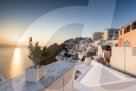 Sunset over the Aegean Sea seen from a terrace of the typical Greek village of Firostefani Santorini Cyclades Greece Europe